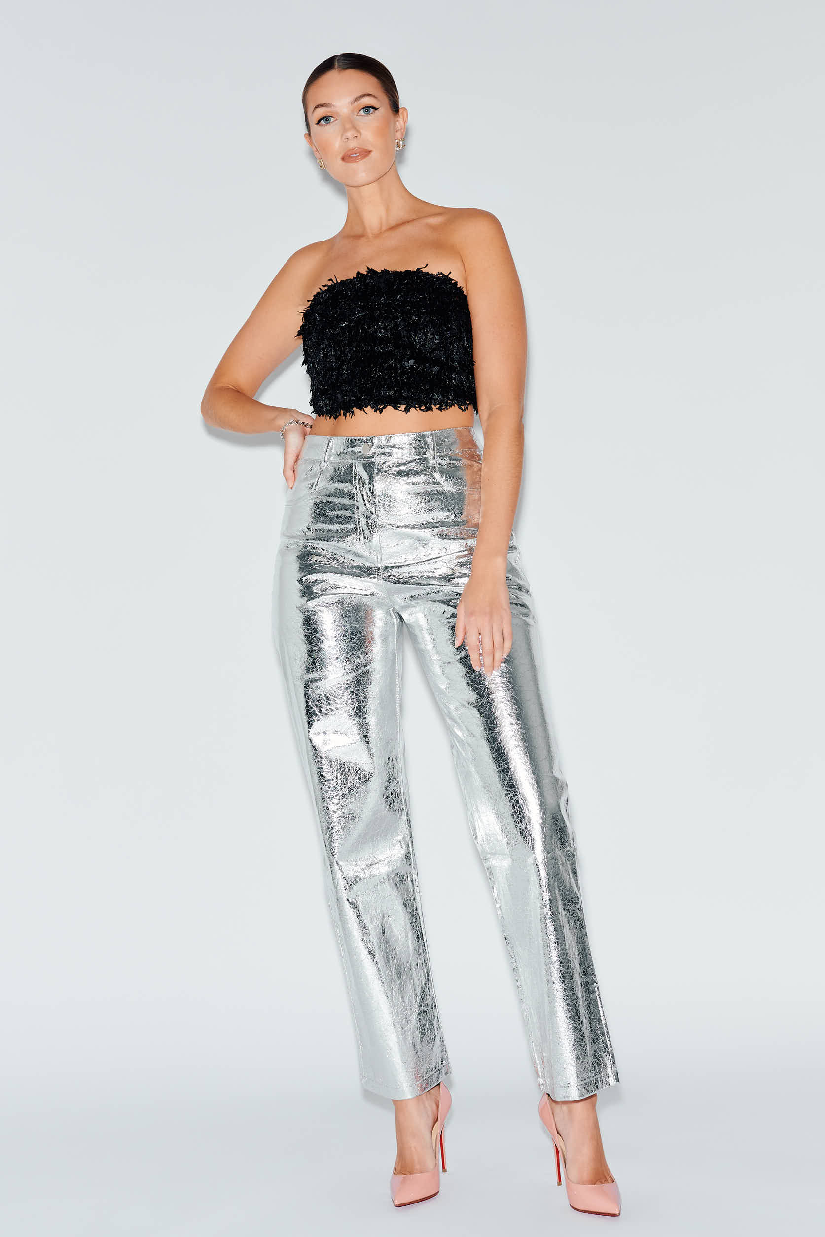 High waist silver faux leather pants with black feather crop top